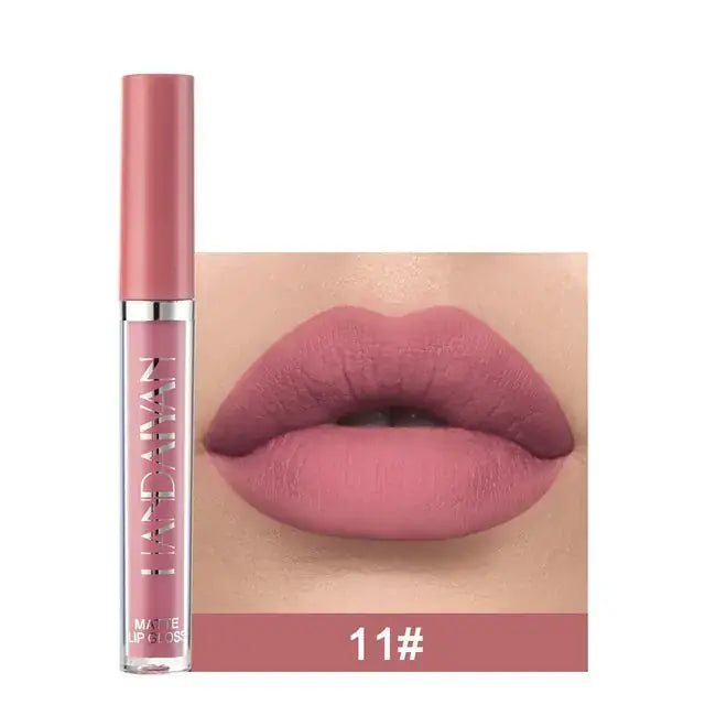 Close-up of lips wearing Handaiyan 11# matte velvet lip gloss, showcasing a soft pink shade - essentials for beauty.